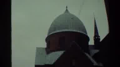 Denmark (1982): View Of Cathedral Spires On Red Building On A Cloudy Day