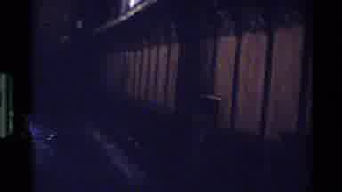 Denmark (1982): People Walking Through A Dark Building
