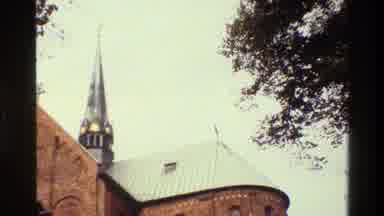 Denmark (1982): A Video Of A Church Roof And Its Steeple As Well As Surrounding