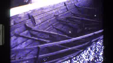 Denmark (1982): A Large Wooden Boat On Dry Land That Has Panels Missing On One
