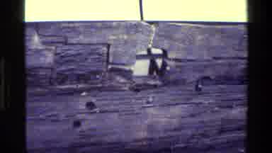 Denmark (1982): Someone Looks Into A Hole There's A Room With A Guy And A Scale