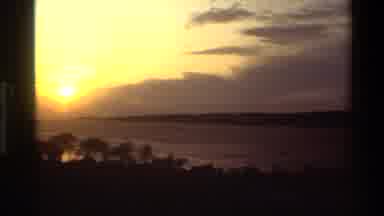 Denmark (1982): Camera Pans From Right To Left Showing Sun And Clouds In Sky Over