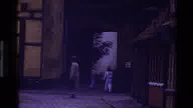 Denmark (1982): People Walking In Their Town During Twilight Hours