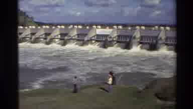 Sacramento California USA (1982): Bystanders Watch From The Riverbank As The Water