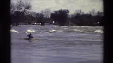 Sacramento California USA (1982): Man Attempting To Paddle Kayak Upstream In