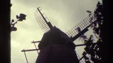 Denmark (1983): Broken Windmill Doesn't Spin Even Though Nearby Trees Indicate