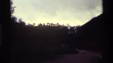 Denmark (1983): Sunlight Warms And Lights The Sky Behind Suburban Homes At Dawn