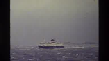 Denmark (1983): Cruise Ship Sailing On Ocean Near Shore With Wave Breaking Against