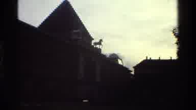 Denmark (1983): Monument Of A Devil Next To Big Buildings While Sunset