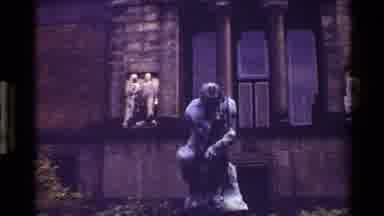 Denmark (1983): Zoom-In And Cut Away Of Old Statues In Front Of Building