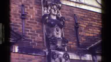 Denmark (1983): People Biking Near Old Buildings That Contain Statues Of Old