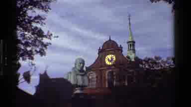 Denmark (1983): View Of Brick Clock Tower And Statue On A Cloudy Day