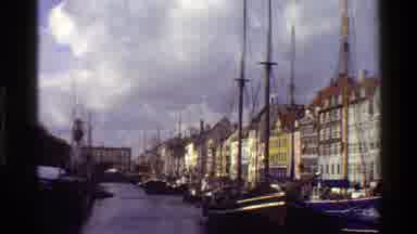 Denmark (1983): A Long List Of Buildings Outside A Dock Of The Bay With Boats And