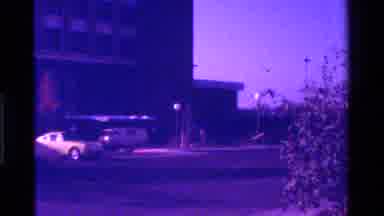 California USA-1975: Vintage 8mm Street Scene With Classic Cars And Purple Tint
