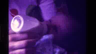 California USA (1975): Tiny Baby Being Fed Milk From A Bottle