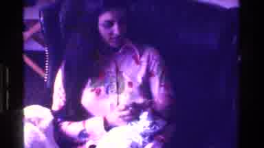 California USA (1975): Zoom In Of Mother Feeding Newborn Baby Milk From A Bottle