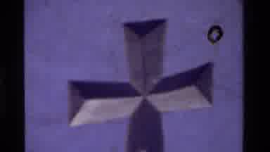 California USA (1975): Old Video With Black Film Dust Zoom On A Grey Celtic Cross