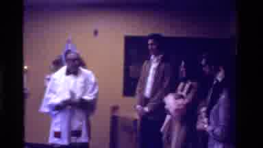 California USA (1975): Priest Is Celebrating A Baby's Birth In A Church With Its
