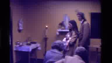 California USA (1975): Baby Being Carried By Mother Followed By Father's Be
