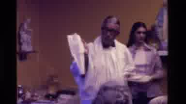 California USA (1975): Catholic Priest In White Robe Putting White Towel Over