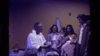 California USA (1975): With Sacred Sculptures Priest Baptizing A Child Into A