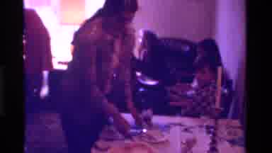 California USA (1975): Retro Party Goers Serving Food