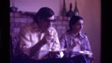 California USA (1975): Family Together In Living Room Mother Feeds New Baby With