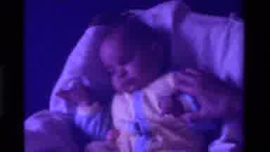 California USA (1975): Baby In Carrier Staring
