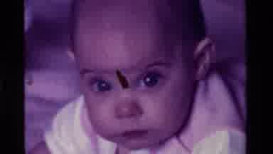 California USA (1975): New Born Baby Learning To Crawl And Discover The New World