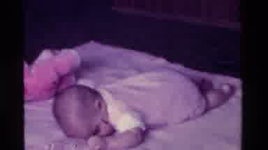 California USA (1975): Tiny Baby Trying To Crawl For The First Time Ever
