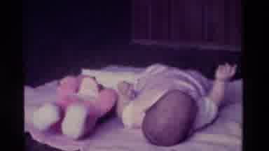 California USA (1975): The Child Is Playing With Toys And Enjoying Very Well