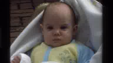 California USA (1975): A Baby Looking In Multiple Directions Uneasy