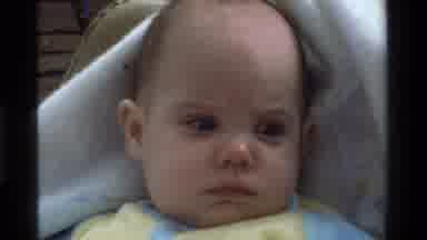 California USA (1975): White Baby In A Very Comfortable White Crib Looking Very