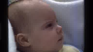 California USA (1975): Baby Sitting In Car Seat Looking