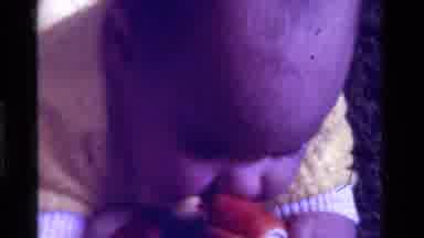California USA (1975): A Little Baby Playing On The Floor With Their Toys