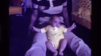 California USA (1975): Mom Or Aunt Playing With A Baby First Sitting Then Holding