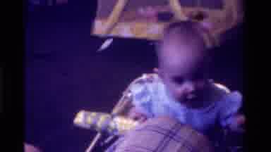 California USA (1975): Baby Playing In Stroller Cute Mom Watching Baby Have Fun