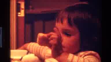 California USA (1977): A Little Girl Eating And Enjoying Her Food