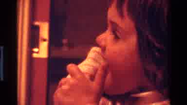 California USA (1977): Weird Kid Licking Her Shirt Sleeve On Her Arm As She Stares
