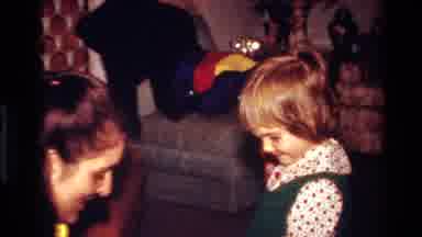 California USA (1977): Happy Girl Gets Winter Mittens For Christmas With Short