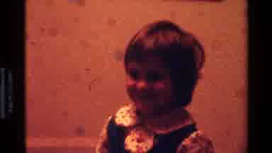 California USA (1977): Baby In A Bouncer And A Toddler Smiling