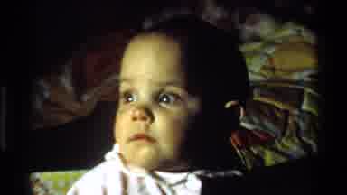 California USA (1977): Baby In Walker Looking Around