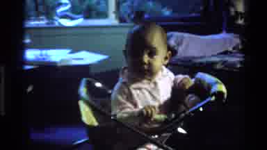 California USA (1977): Baby In Walker Playing