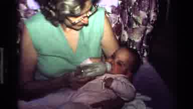 California USA (1977): The Lady Was Feeding The Baby And The Baby Was Drinking The