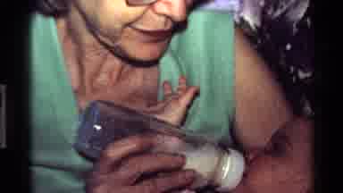 California USA (1977): Feeding Bottle With Baby