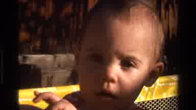 California USA (1977): Toddler Unsure Whether To Believe What He Is Being Told