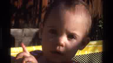 California USA (1977): Cute Baby Outside In The Sun Enjoying Life And Playing