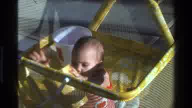 California USA (1977): The Baby Play With A Cup