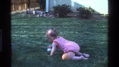 California USA (1977): Baby Crawling For Ball