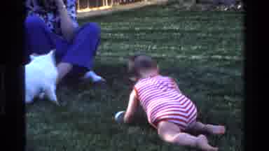 California USA (1977): A Grandparent Playing With A Baby